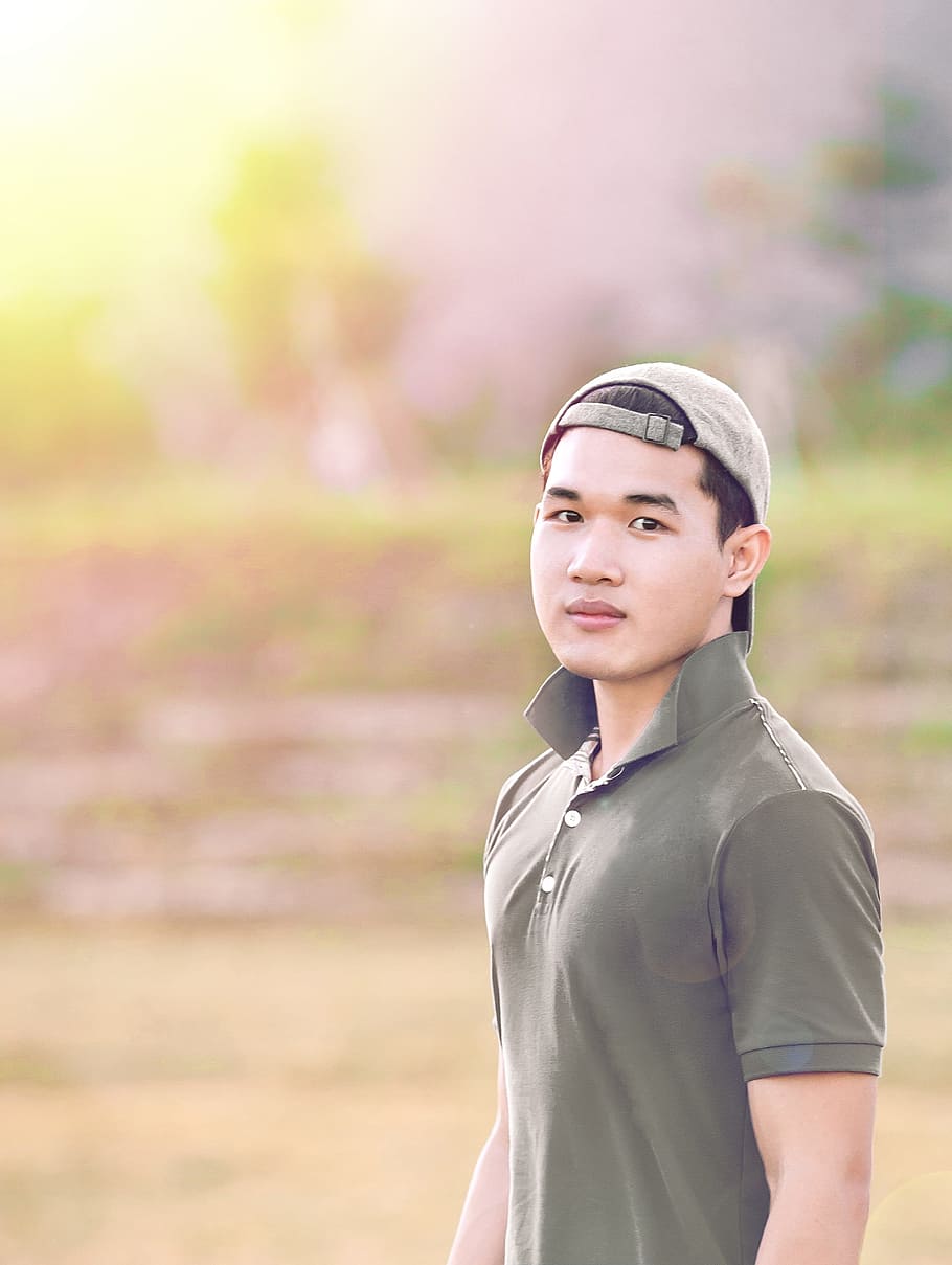 man standing on field, nice, left, young, cap, light, outdoors HD wallpaper