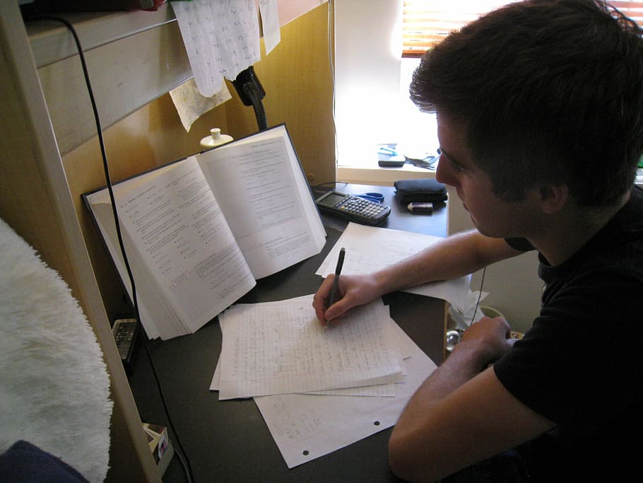 man wearing shirt holding pen, student, concentrated, preparation