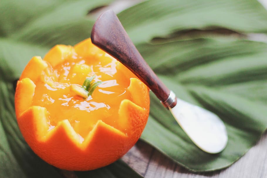 sliced citrus fruit beside utensil on green leaf, vegetable, food HD wallpaper