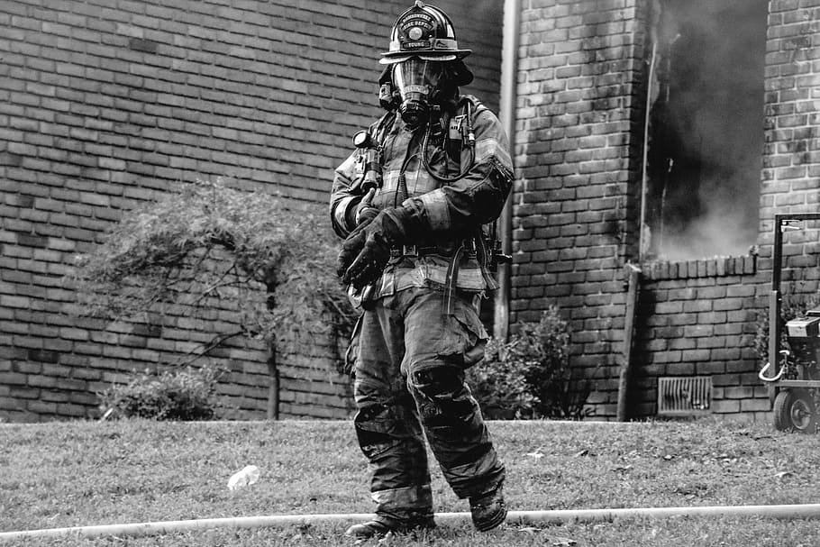grayscale photo of firefighter, grayscale photo of man wearing fireman suit