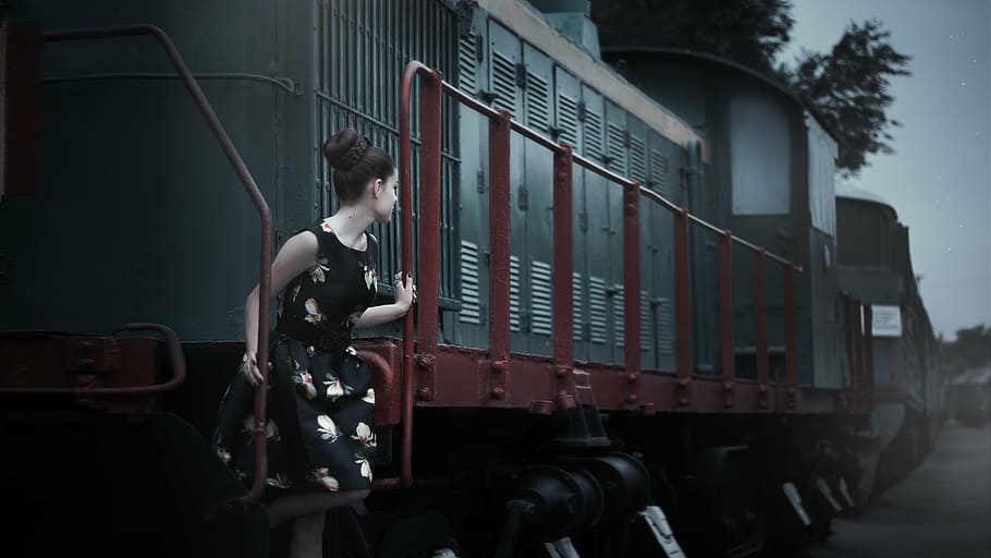 photo of woman standing on train stair, pin up girl, retro, fashion