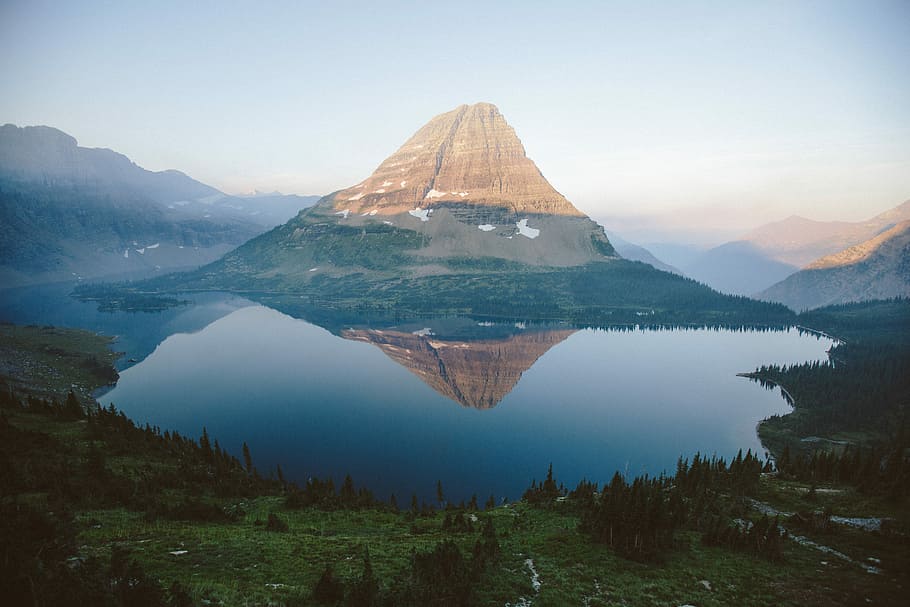 aerial view of lake near mountains, landscape photography of mountain and body of weater HD wallpaper