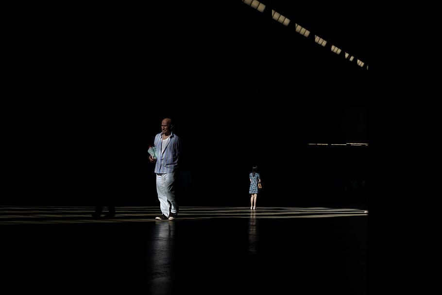 person standing on platform in dark area, man standing near mirror HD wallpaper