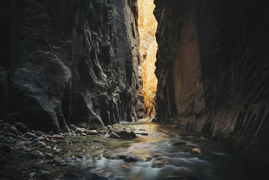 body of water on ridge between two rock formations, body of water between rocks HD wallpaper
