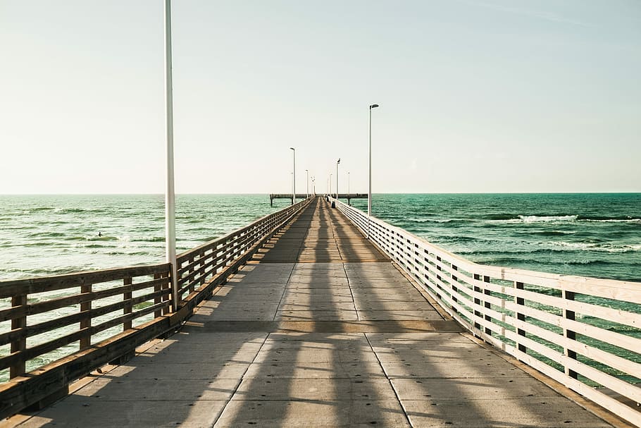 Wide ocean pier, footbridge over body of water photograph, coast HD wallpaper