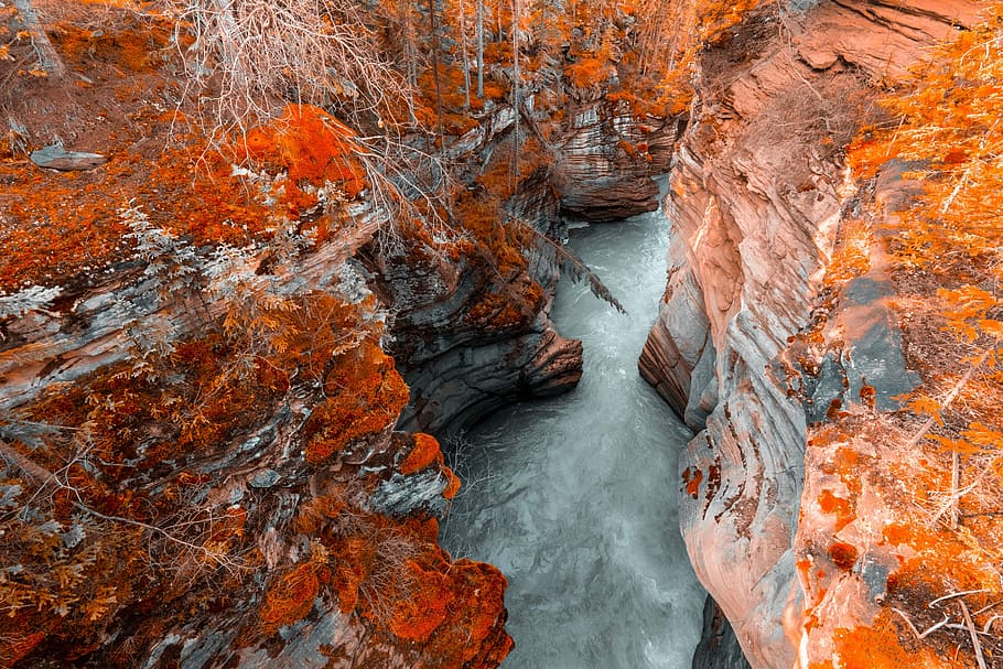 body of water between two cliffs, body of water between mountains HD wallpaper
