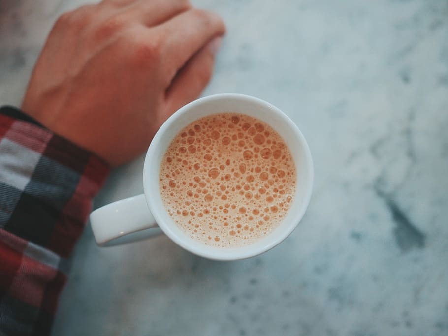 mug with coffee in shallow focus, white ceramic mug on gray marble-top table HD wallpaper