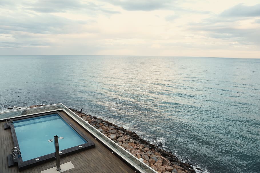 high angle view of swimming pool beside body of water, seaside HD wallpaper