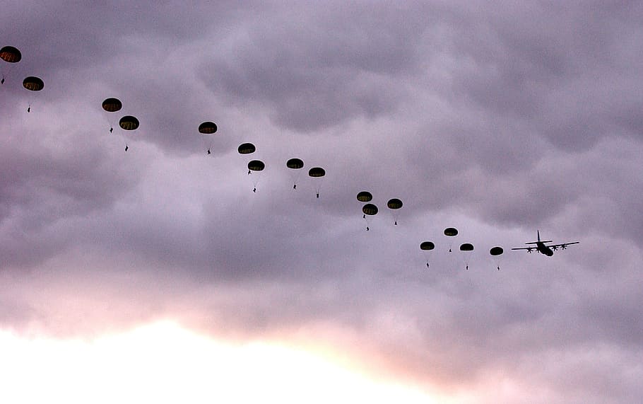 person diving with parachute on sky, australia, clouds, australian parachutists
