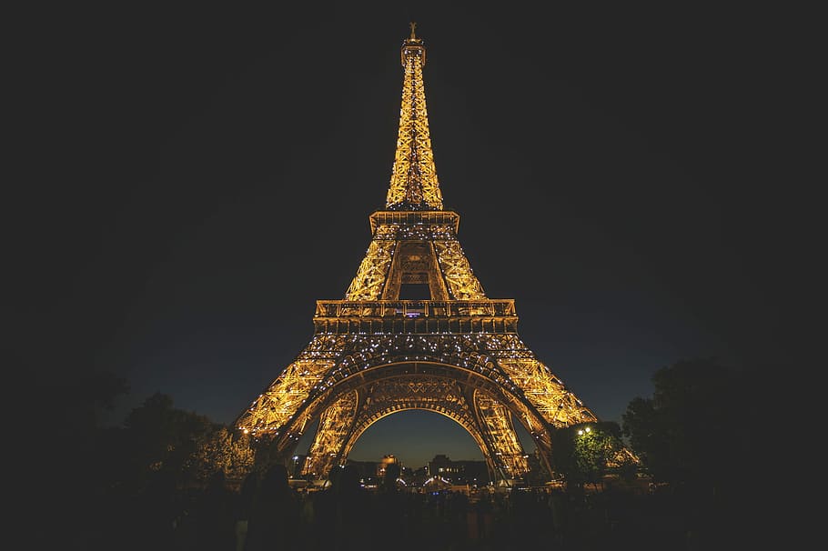 Eiffel Tower during nighttime, low angle photography of Eiffel Tower, London HD wallpaper