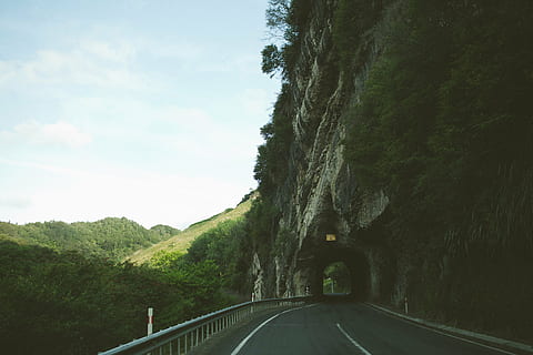 gray concrete road midst tunnel, asphalt, leading, sky, winding HD wallpaper