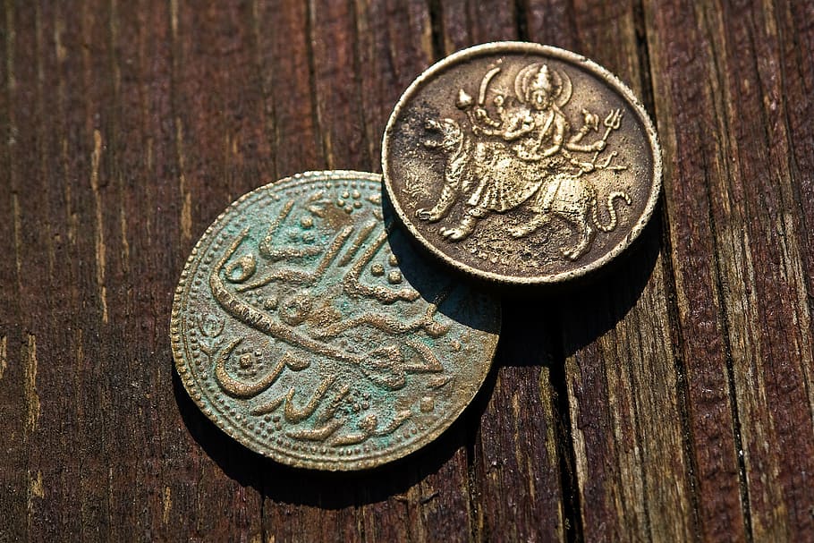 two round bronze-colored Indian rupee coins, money, metal, wood