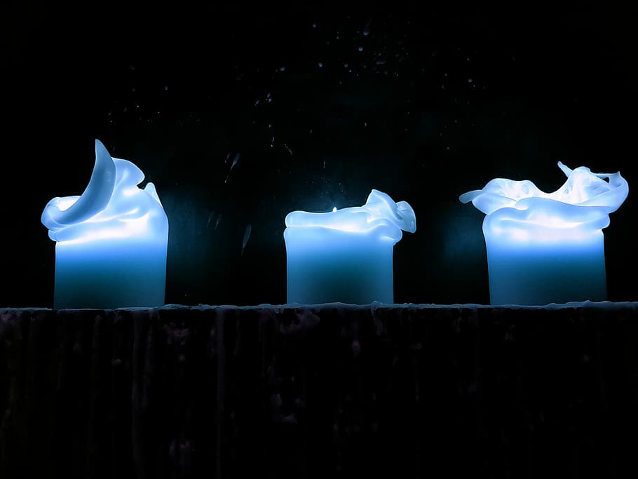 Three dancing candles, three blue candles on wall, lights, burning HD wallpaper