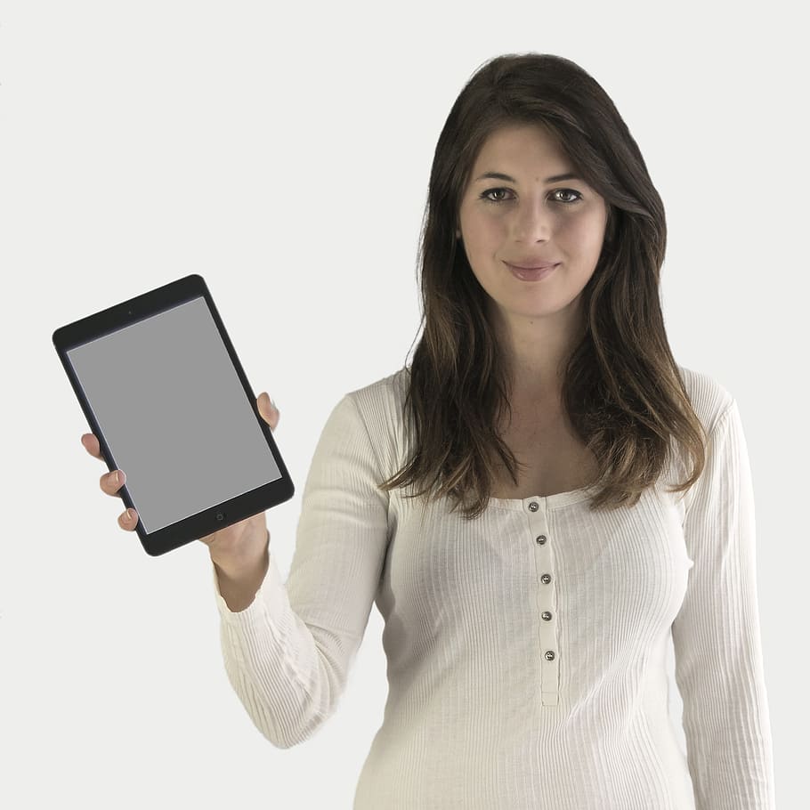 woman wearing Henley long-sleeved top holding black iPad, presentation