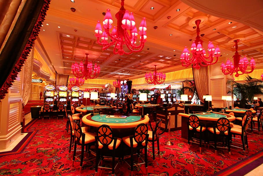 dining tables and chairs on red carpet, Wynn Casino, Las Vegas
