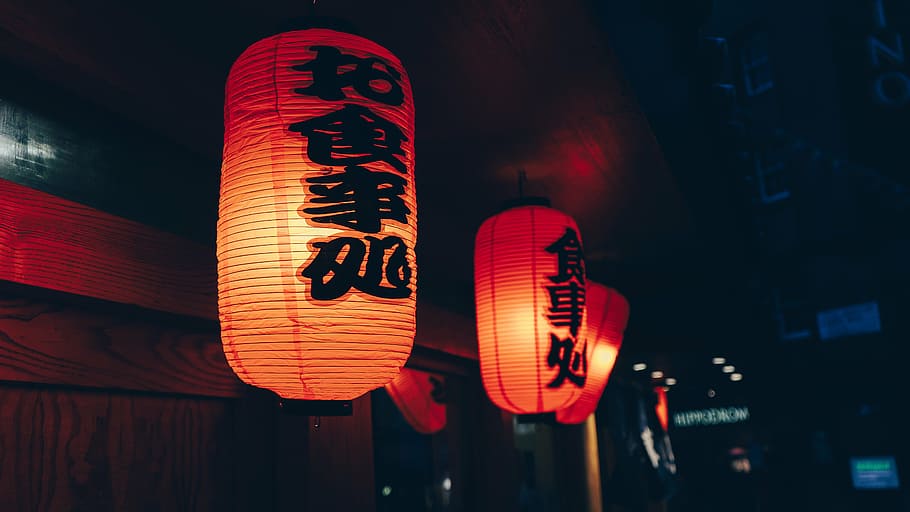selective focus photography of three red candle lanterns hanged on door front HD wallpaper