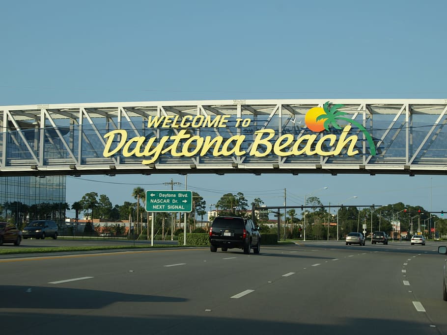 Daytona Beach signage hanged on bridge, florida, text, western script