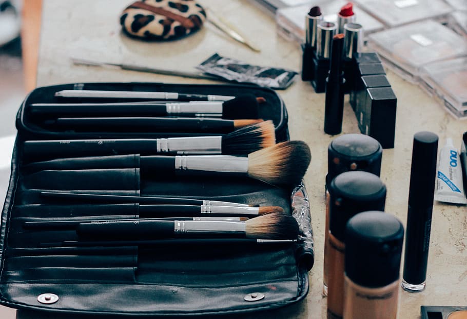 makeup brushes near bottles, make up, beauty products, cosmetics