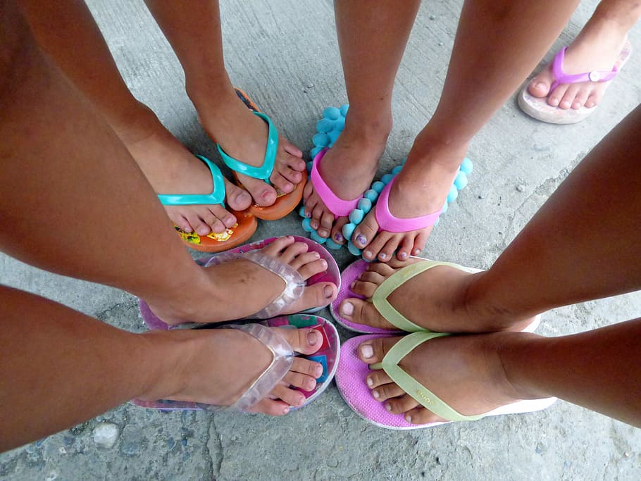 photo of five persons wearing rubber flip flops, foot, children