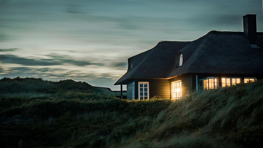 Gray House With Fireplace Surrounded by Grass Under White and Gray Cloudy Sky HD wallpaper