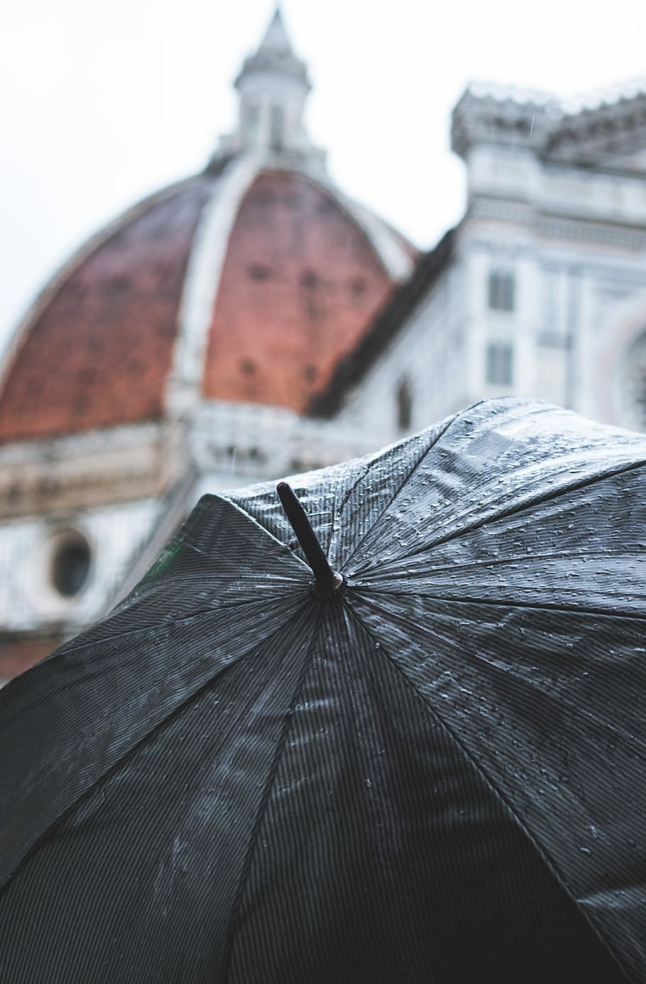 gray umbrella near cathedral, selective close up photo of black umbrella HD wallpaper