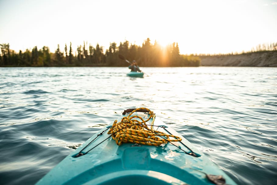 person silhouette photo of person on-board in green kayak near other person in green kayak, teal sit-on-top kayak on body of water photo HD wallpaper