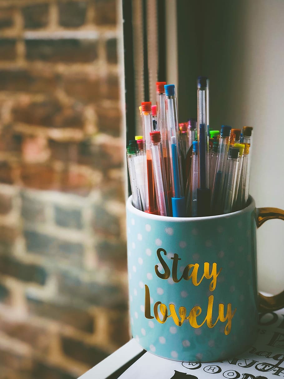 pens in blue ceramic mug in front of window during daytime, assorted-color pen lot in teal ceramic mug HD wallpaper