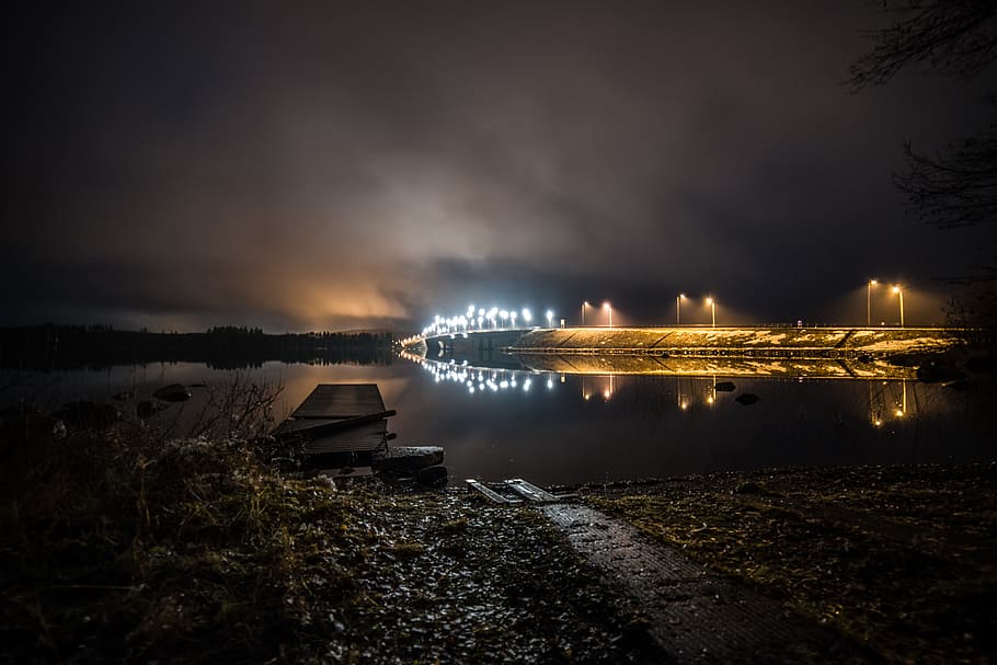 Walls With Lights Near Calm Body of Water at Night Time, backlit HD wallpaper