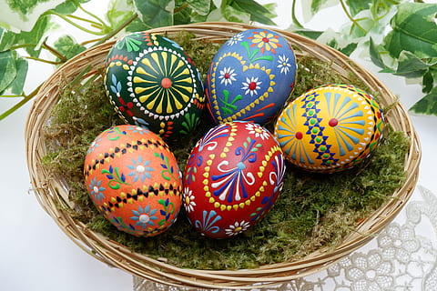 several assorted-color Easter eggs on brown wicker basket, ornament HD wallpaper