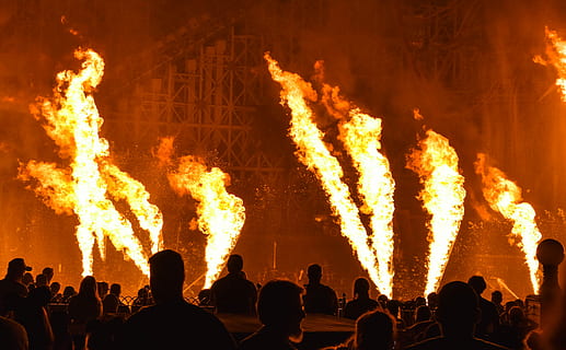 red fires in stage, people sitting near fire, flames, burning HD wallpaper
