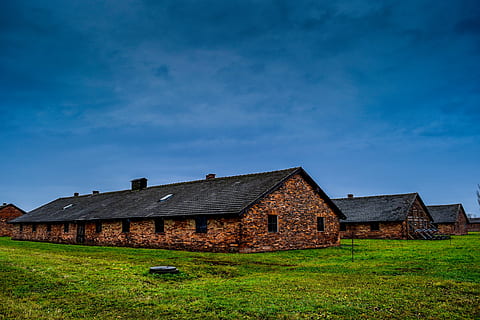 brown concrete house in green grass field, holocaust, poland HD wallpaper