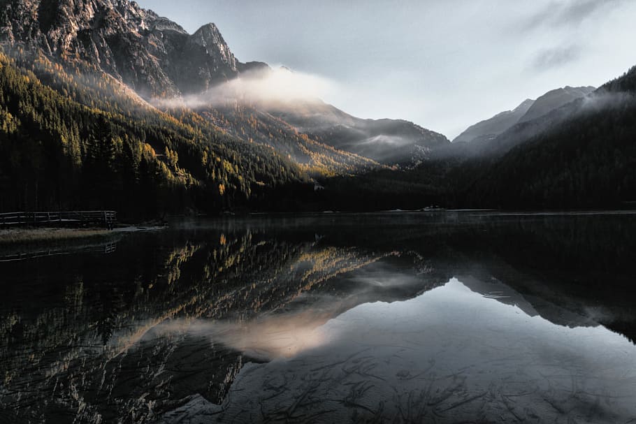 mountain range in landscape photography, mountain reflecting on body of water HD wallpaper
