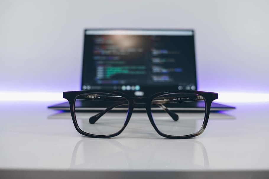 eyeglasses with black frames on white desk, black framed eyeglasses in front of laptop inside table HD wallpaper
