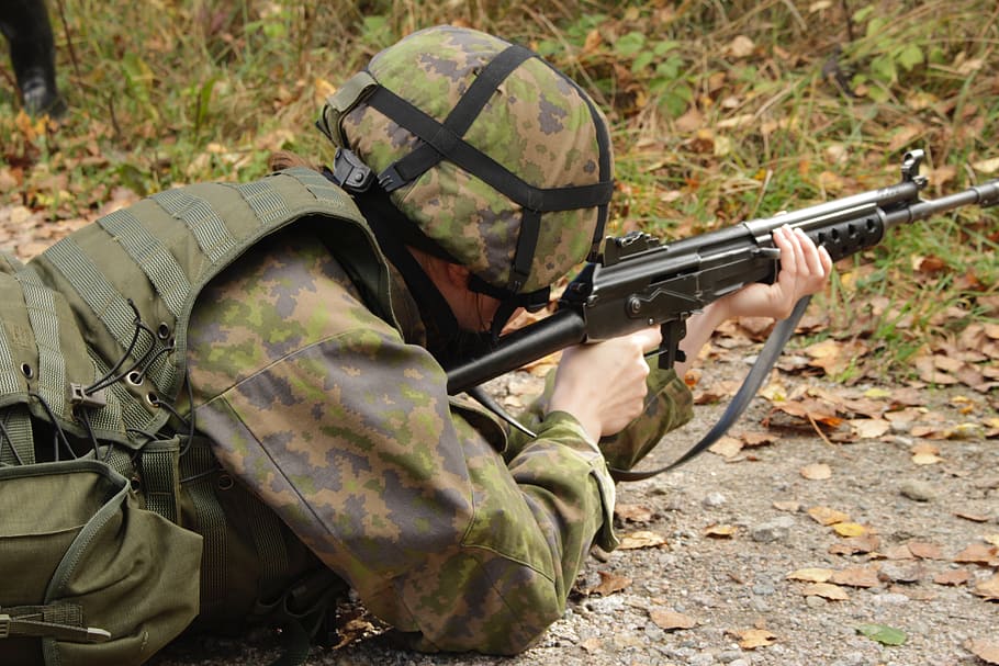 military holding rifle, the weapon, lying, helmet, army, sotilasasu