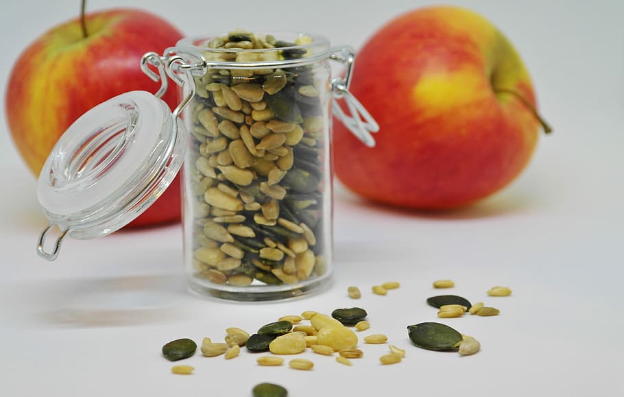 clear glass jar and two apples, sunflower seeds, pumpkin seeds, HD wallpaper