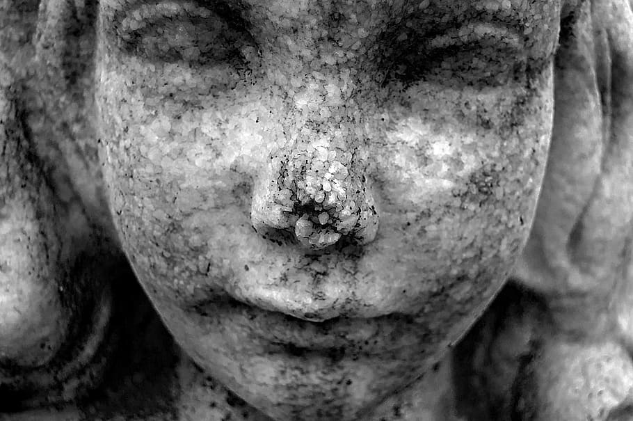 close up photo of female statue, child, girl, stone, texture