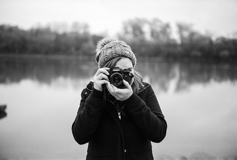 shallow focus photography of woman taking photo, photographer