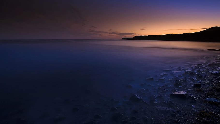 gray rocks near on seashore, sunset, evening glow, scenics HD wallpaper