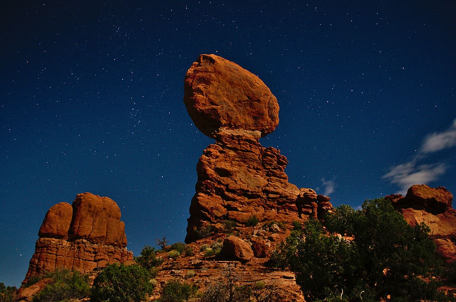 low-angle of rock mountains, stone formation on mountain under night sky HD wallpaper
