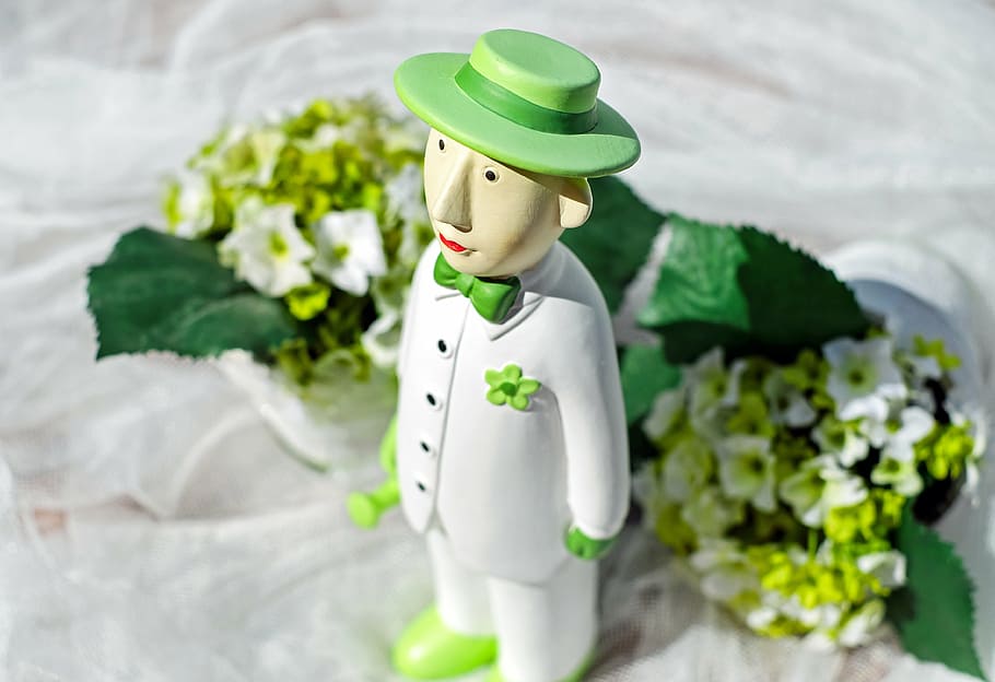 male character wearing white button-up jacket figurine near white petaled flower bouquet HD wallpaper