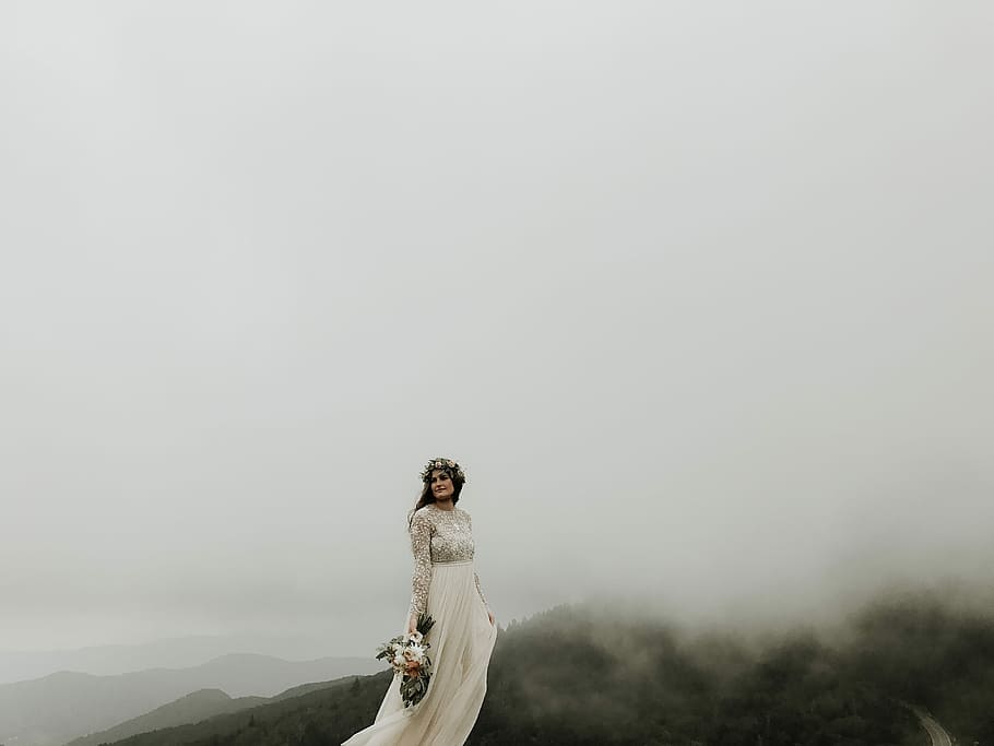 woman wearing wedding gown standing on top of hill, woman at the peak of the mountain wearing wedding dress HD wallpaper