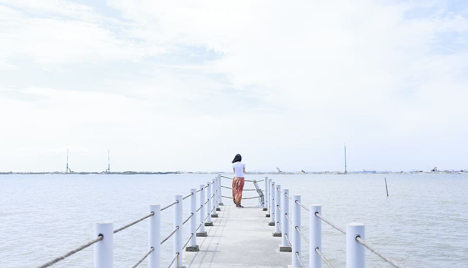 jetty, sea, nature, sky, alone, back view, beach, calm, clouds HD wallpaper