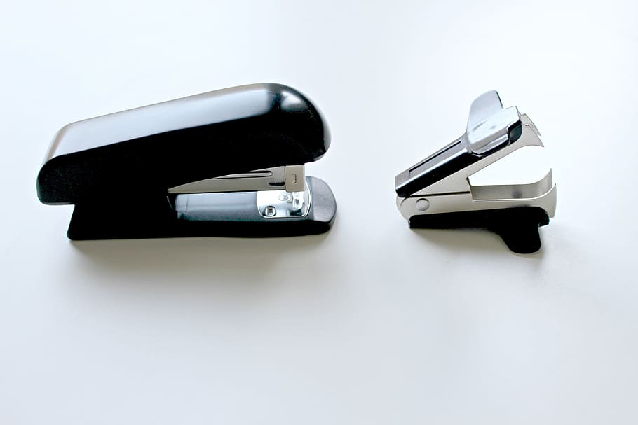 Office stapler and paperclip, various, business, close-up, white