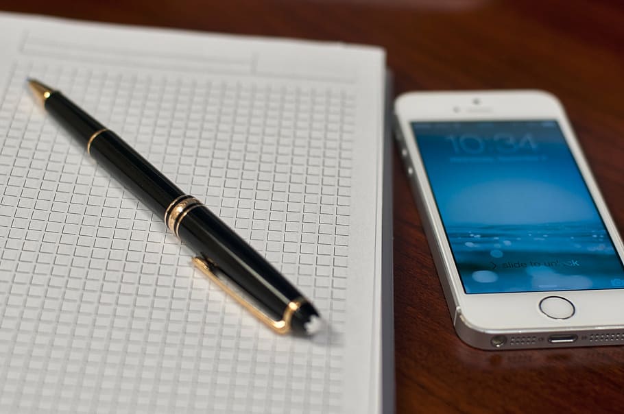 silver iPhone 5s beside twist pen, notepad, mont blanc, notes HD wallpaper