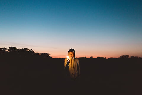 person holding light in dark open space, Pathos of Things, man HD wallpaper