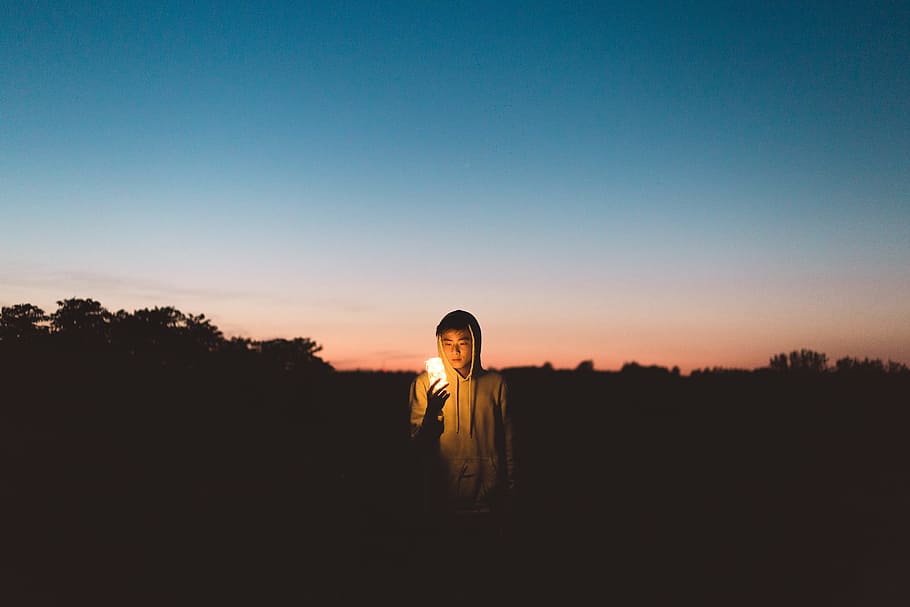 person holding light in dark open space, Pathos of Things, man HD wallpaper