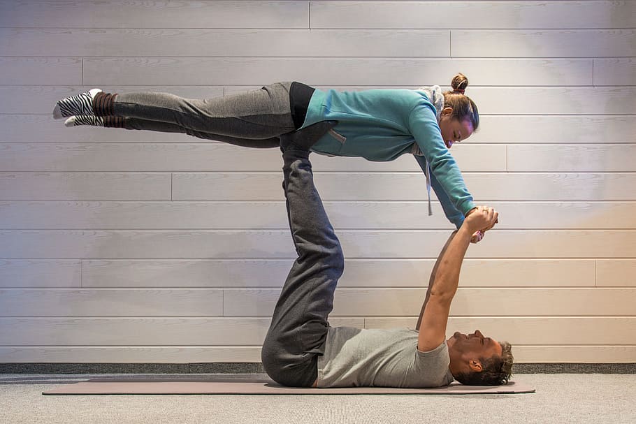 Couple Practicing Acro Yoga High-Res Stock Photo - Getty Images
