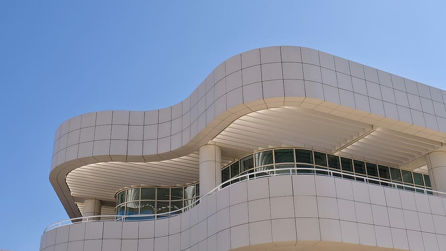 low angle photography of white concrete building, gray concrete building under blue sky HD wallpaper