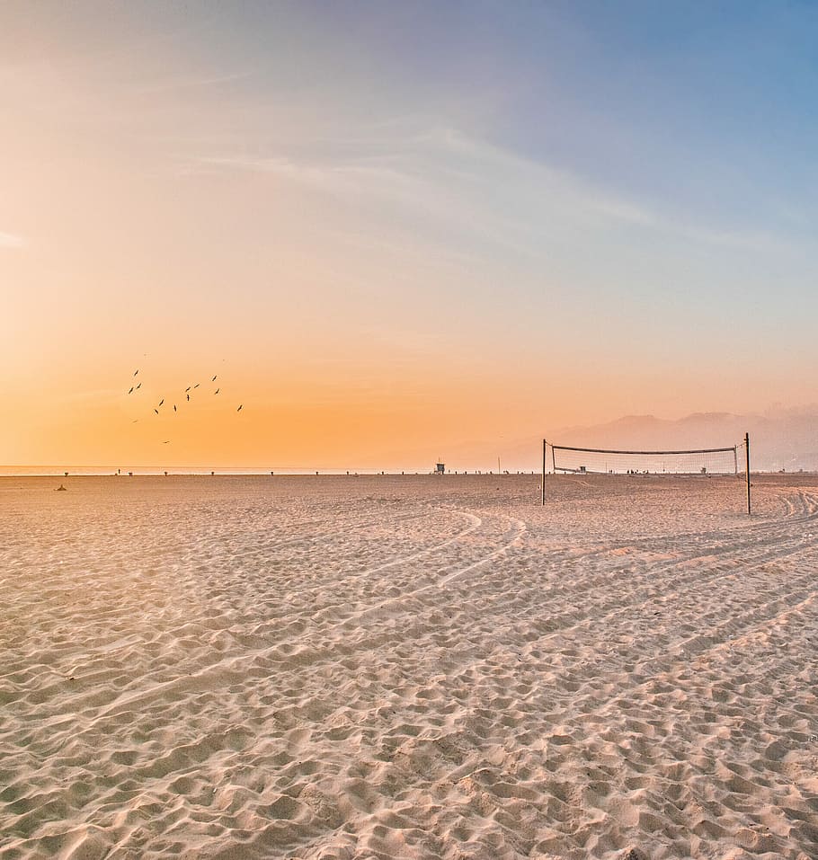 photo of volleyball net on sands, black post on gray sand, beach HD wallpaper