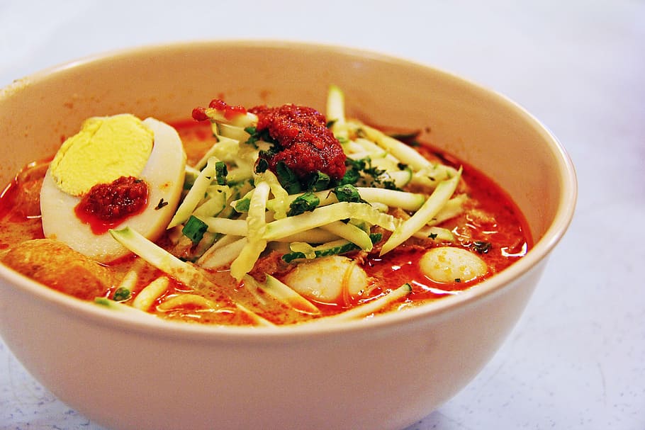 noodle dish with hard boiled egg, laksa, popular, famous, coconut